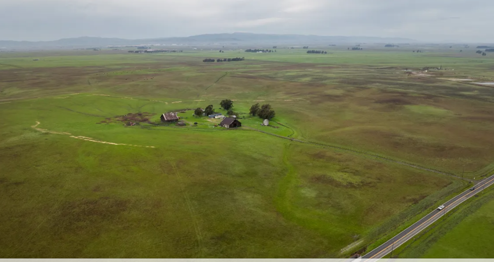 An aerial view of a farm on land where California Forever plans to build its new city in Solano County on Feb. 16, 2024. The proposed development would be located between Travis Air Force Base and Rio Vista. (Photo by Loren Elliott for CalMatters)