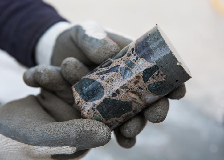 A concrete core is removed from a spillway by SMUD craft worker Jacob Walker to evaluate bonding of a capping repair. A concrete core is removed from a spillway by SMUD craft worker Jacob Walker to evaluate bonding of a capping repair.