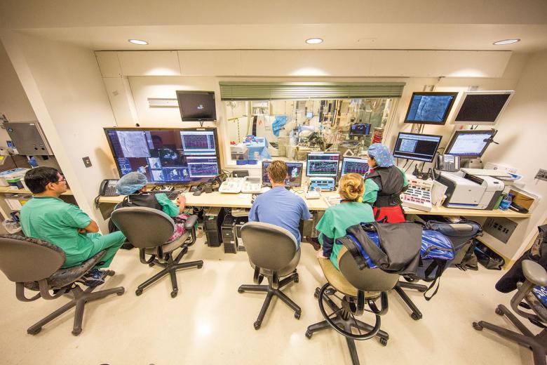 While in the procedure room, cardiologist Dr. Uma Srivatsa uses a robotic magnet-guided catheter system, with the help of the electrophysiology team, to identify the structures, electrical voltage and activation pattern of the patient’s abnormal heartbeat.
While in the procedure room, cardiologist Dr. Uma Srivatsa uses a robotic magnet-guided catheter system, with the help of the electrophysiology team, to identify the structures, electrical voltage and activation pattern of the patient’s abnormal heartbeat.