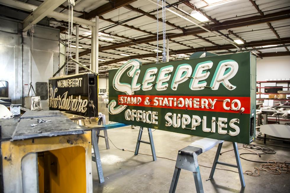 Vintage neon signs sit on the floor of the Pacific Neon workshop after being delivered from the “neon graveyard” at the Center for Sacramento History. (Photos by Joan Cusick)
