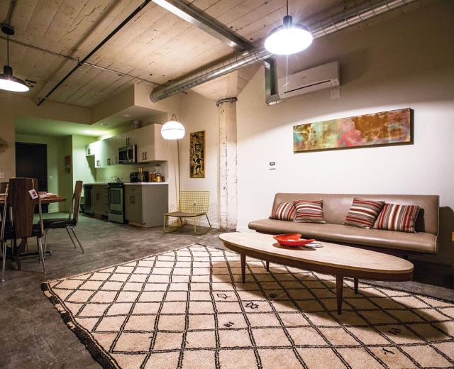  Units in the renovated industrial space at Warehouse Artist Lofts feature exposed ductwork, original concrete columns and period-appropriate light fixtures.
