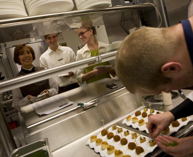Kitchen staff plates hors d'oeuvres on the Ritz-Carlton's opening day