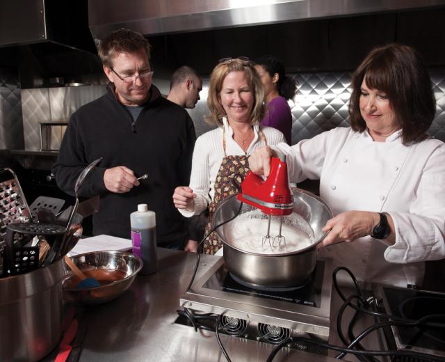 Paulette Bruce (far right), owner of Good Eats Cooking Classes, teaches a Sunday morning group at East Bay Restaurant Supply.
