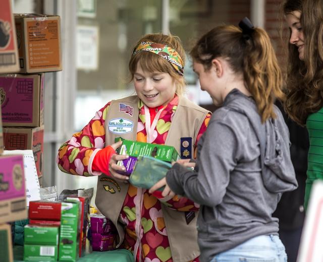 Claire Simon sells Girl Scout cookies