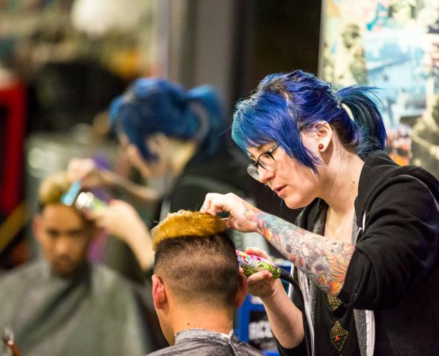 When a new client hears his barber’s name is Renee, he might envision an “old French dude” and not a young woman. The industry remains, after all, a field of men. “When I was in school, it was me and 60 dudes,” says Renee Green, 29 (pictured standing).