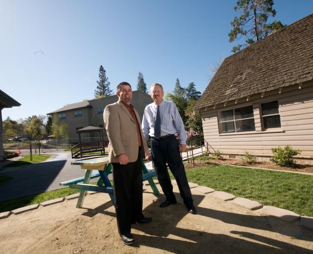 Randy Tooker, chief professional officer of the Auburn Boys & Girls Club, with Community 1st Bank president Mark Lund at the club's new site