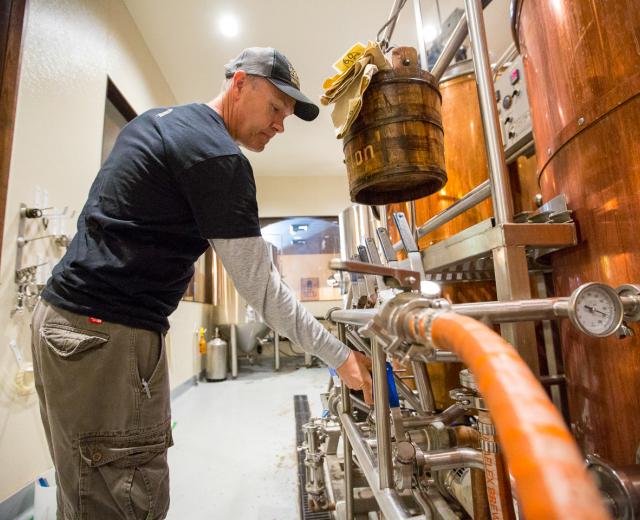 Monk’s Cellar in downtown Roseville smells vaguely of an oatmeal breakfast. It’s actually a new batch of beer brewing, called Friar Funk, a Flemish red ale with wine-like characteristics. Brewmaster Andy Klein (pictured) stirs a mash of barley and hot water for about 15 minutes to activate enzymes that convert starches into sugars.