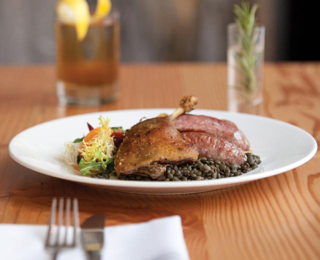 Duck Confit and Pork Sausage with green lentils, duck fat fingerlings, frisee, bacon, stonefruit and champagne vinaigrette paired with Original Formula Manhattan made with James E. Pepper 1776 rye whiskey, Vya sweet vermouth, Small Hand Foods gum syrup and house citrus bitters