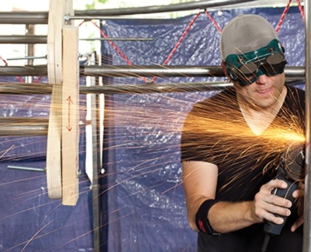 Casey Marshall works on "The Monitaur" at Hacker Lab