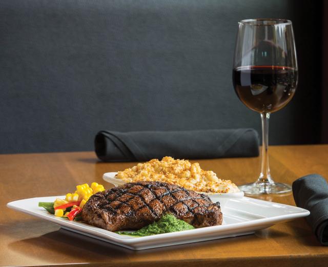 At The Independent, dry-rubbed, ancho-crusted ribeye with housemade chimichurri, vegetables and truffle mac and cheese. Paired with a 2010 Sierra Foothills Windwalker Vineyard Zinfandel