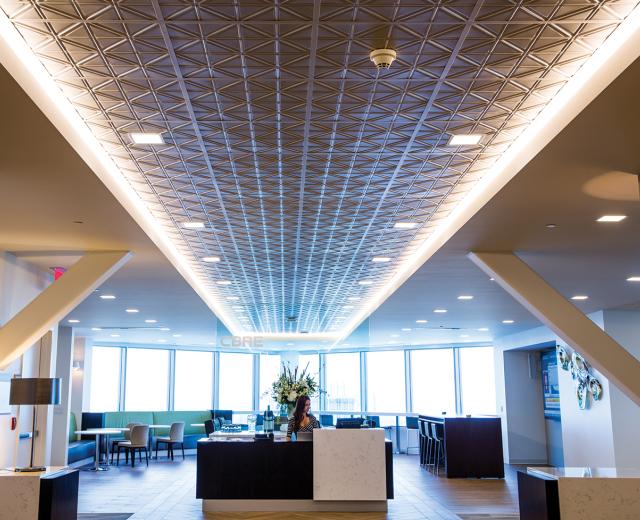 Flexible seating solutions at CBRE in downtown Sacramento allow employees to sit anywhere, work while standing or grab a window seat in the lobby lounge.