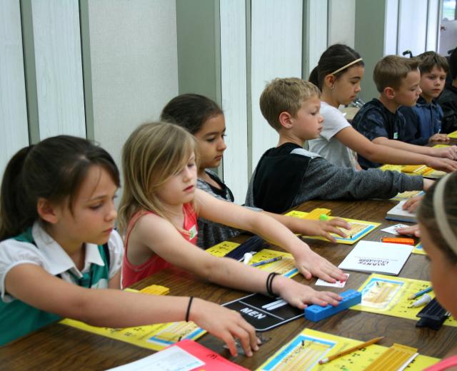 Students feel examples of braille during an ATOU workshop. (Photo courtesy Meghan Adamski)