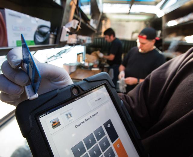 Drewski’s Hot Rod Kitchen uses Square, a mobile credit card reader, to process customer payments on location.