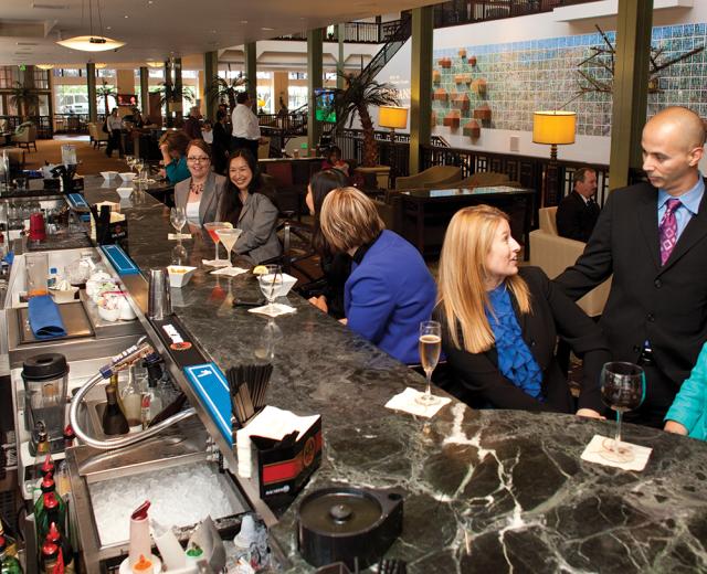 Although vacancies at the Sheraton Grand have increased the past few years, the lobby's bar has maintained business. 