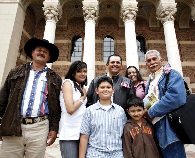 Mexican national Yulithza Ortiz (center) strands outside the Memorial Auditorium surrounded by family after his U.S. citizenship ceremony last month. 