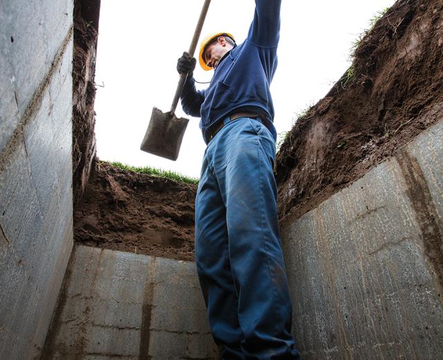 East Lawn Memorial Park has roots that go back more than 110 years — before “six feet under” was just a euphemism. Groundsman Nick Ustymchuk uncovers a concrete chamber, which will hold a casket or cremated remains