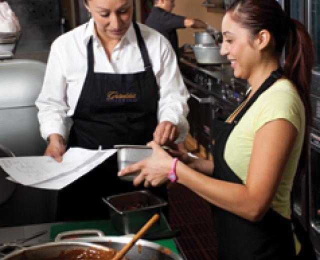 Griselda Barajas (left) provides health care insurance to her 10 employees at Griselda's Catering in Sacramento. Her small business is in the minority of those that can offer such benefits. 