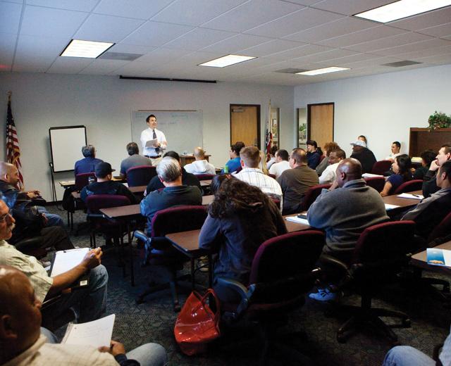 Unemployed San Joaquin residents gather at WorkNet to hear a seminar on building a resume. 