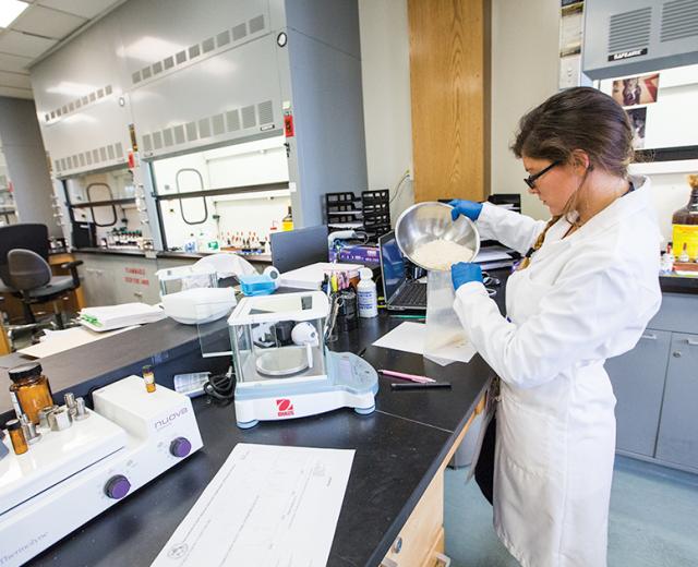 Criminalist Caitlin Little pours nearly 450 grams (about one pound) of methamphetamine into an evidence bag at the Sacramento County District Attorney’s Crime Lab. This is considered a large methamphetamine case compared to the average case of .20 to .25 grams, according to Jill Ibarreta, the supervising criminalist of the lab’s chemistry section.