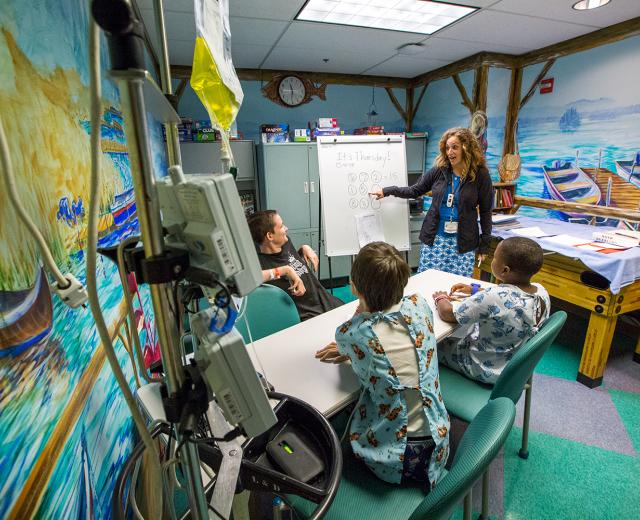 UC Davis Children’s Hospital teacher Nicole Castle warms up Richard, Reese and Jahmarcus with math puzzles before hitting the books. Castles is the sole instructor for all school-aged children in the pediatrics ward, as well as school-age patients in other wings of the hospital. In a given week she’ll schedule bedside sessions with as many as 30 students.