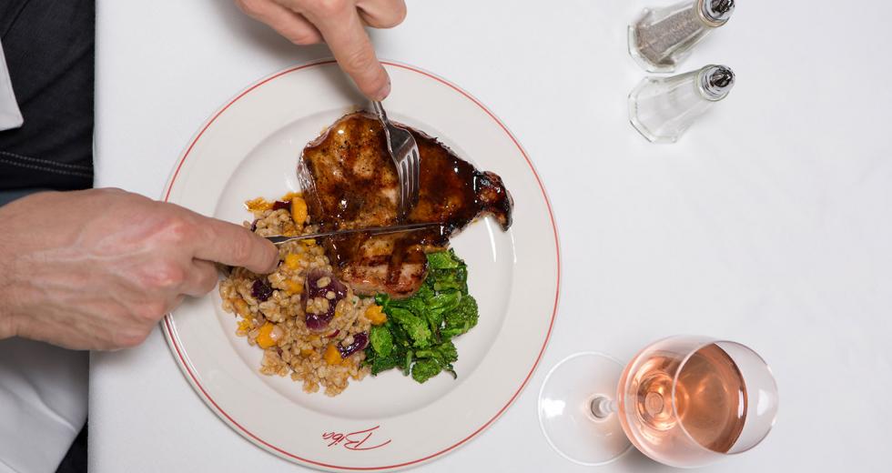 On Biba restaurant’s menu: Grilled Niman Ranch pork porterhouse cut with a balsamic vinegar glaze served with farro, butternut squash and radicchio.