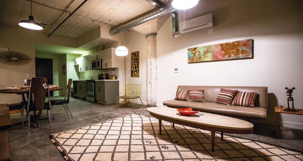  Units in the renovated industrial space at Warehouse Artist Lofts feature exposed ductwork, original concrete columns and period-appropriate light fixtures.
