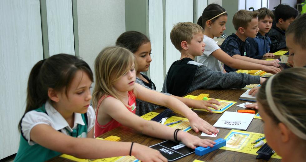 Students feel examples of braille during an ATOU workshop. (Photo courtesy Meghan Adamski)