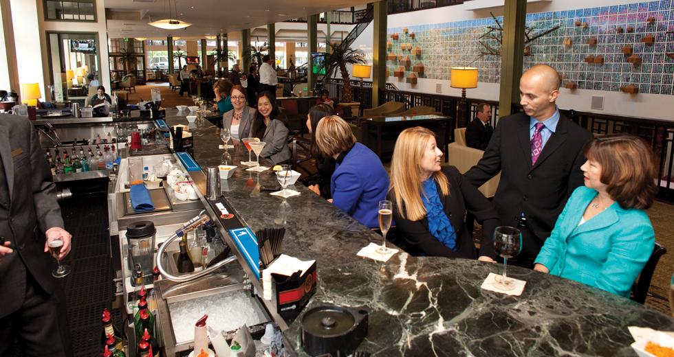 Although vacancies at the Sheraton Grand have increased the past few years, the lobby's bar has maintained business. 