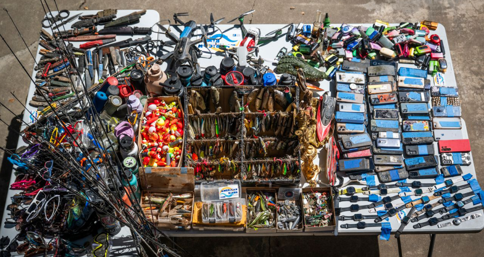Bly’s collection of found objects grows each summer. He tries to locate their owners through the American River Lost & Found social media pages, but plenty of “treasures” remain unclaimed. (Photo by Gabriel Teague)