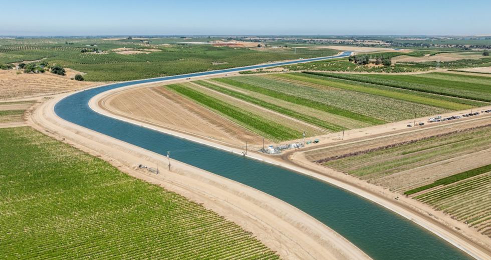 An irrigation canal runs past farmland in Modesto. (Shutterstock photo)