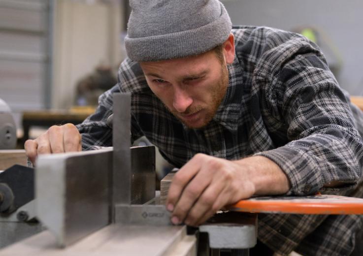 Artisan furniture maker Trent Dean cuts steel leg sleeves that will connect wooden legs to the metal top of an end table he’s making for West Elm LOCAL, a program launched in 2013 that partners the company with independent makers to distribute their work in local stores. Dean crafts the legs with salvaged, locally-sourced walnut from the Sacramento Tree Foundation Urban Wood Rescue program.