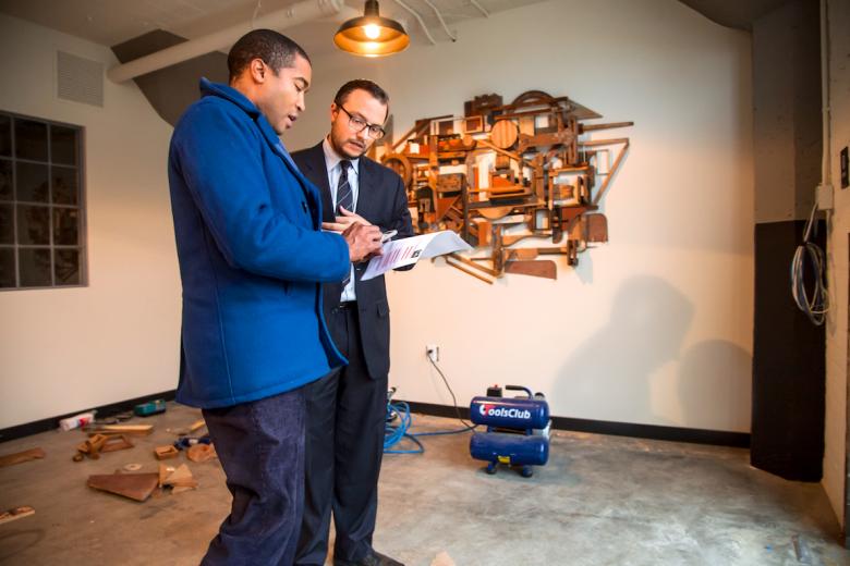 Curator Tre Borden (left) and developer Ali Youssefi (right) discuss art installations for the Warehouse Artists Lofts on R Street Curator Tre Borden (left) and developer Ali Youssefi (right) discuss art installations for the Warehouse Artists Lofts on R Street
