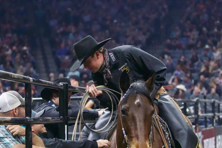 Jared Groene, PBR “In-Arena Safety Man,” AKA wayward bull roper, during first-round action at the Sacramento event.