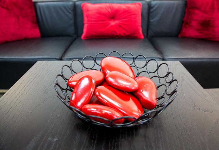 The firm has many clients in the high-end home products category, and the past 15 years of placing millions of client ad dollars in publications like Architectural Digest and Veranda has informed much of the style in the “red room.” Barcelona and Hercules-inspired chairs and couches are framed by wine-red accent walls, and the dark wood bar features a True Residential beverage center. It’s a feature the staff loves and is the product of a current Merlot client. The firm has many clients in the high-end home products category, and the past 15 years of placing millions of client ad dollars in publications like Architectural Digest and Veranda has informed much of the style in the “red room.” Barcelona and Hercules-inspired chairs and couches are framed by wine-red accent walls, and the dark wood bar features a True Residential beverage center. It’s a feature the staff loves and is the product of a current Merlot client.