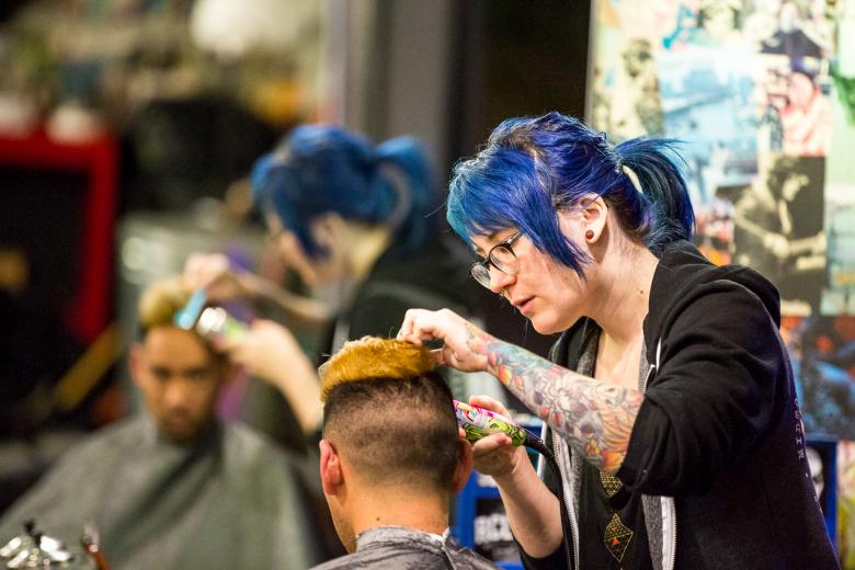 When a new client hears his barber’s name is Renee, he might envision an “old French dude” and not a young woman. The industry remains, after all, a field of men. “When I was in school, it was me and 60 dudes,” says Renee Green, 29 (pictured standing).