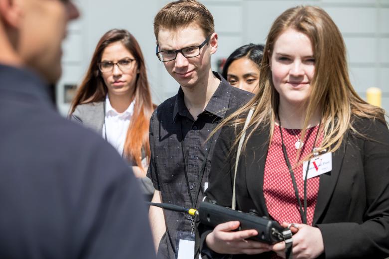 Kyle Boal watches Emily Ann Nunez operate a remote-controlled bomb probe.