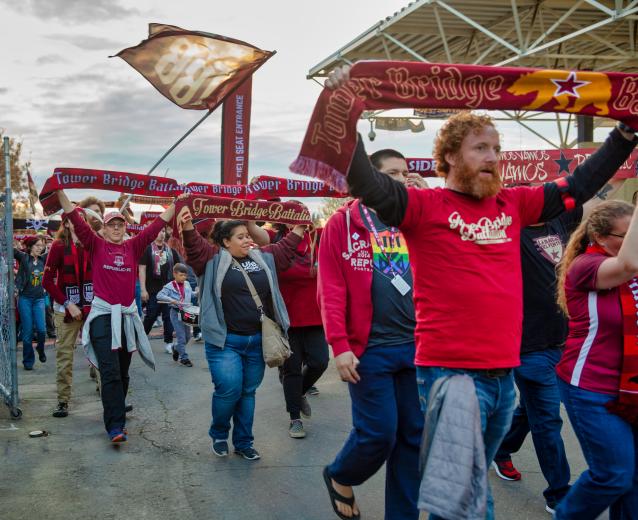 Tower Bridge Battalion members march into Papa Murphy’s Park before the sold-out game April 6.