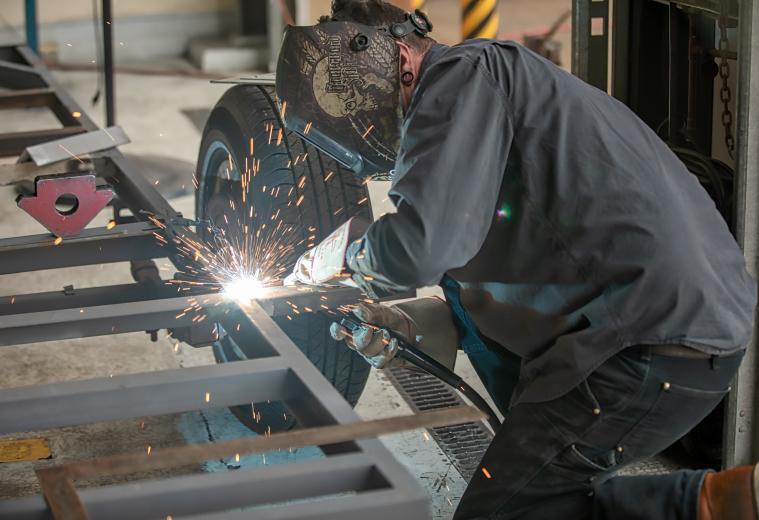 NCCT welding instructor Tyler Wood works on a piece for a barbeque trailer that will be used by the City of West Sacramento and the Sail Inn Grotto & Bar. NCCT students — most are hired for construction jobs — have worked on projects for various businesses, including Sacramento Republic FC, the Sacramento Kings and Raley’s. (Photo by Steve Martarano)