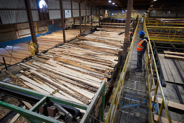 Mark Luster, of Sierra Pacific, walks through one of two sawmills at the company’s Lincoln location. The site also has a biomass facility to power its operations.