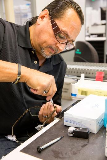 Gerardo Aguilar, a senior finishing technician, has been with VSP for 26 years. Here, he works on mounting a acetate frame. The frames are delicate, and Aguilar says it requires a gentle touch to ensure you don’t do any damage. Gerardo Aguilar, a senior finishing technician, has been with VSP for 26 years. Here, he works on mounting a acetate frame. The frames are delicate, and Aguilar says it requires a gentle touch to ensure you don’t do any damage.
