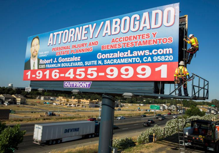 Billboards have been a staple of American advertising since the late 1800s. Originally, crews pasted several strips of posters together to create one large billboard. Now, they use vinyl engineered to withstand harsh weather — the material is waterproof and UV protected.  Billboards have been a staple of American advertising since the late 1800s. Originally, crews pasted several strips of posters together to create one large billboard. Now, they use vinyl engineered to withstand harsh weather — the material is waterproof and UV protected.