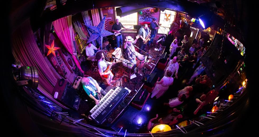 A view from the upstairs at Folsom’s Powerhouse Pub as Mick Martin and his band perform before an energetic crowd in July.