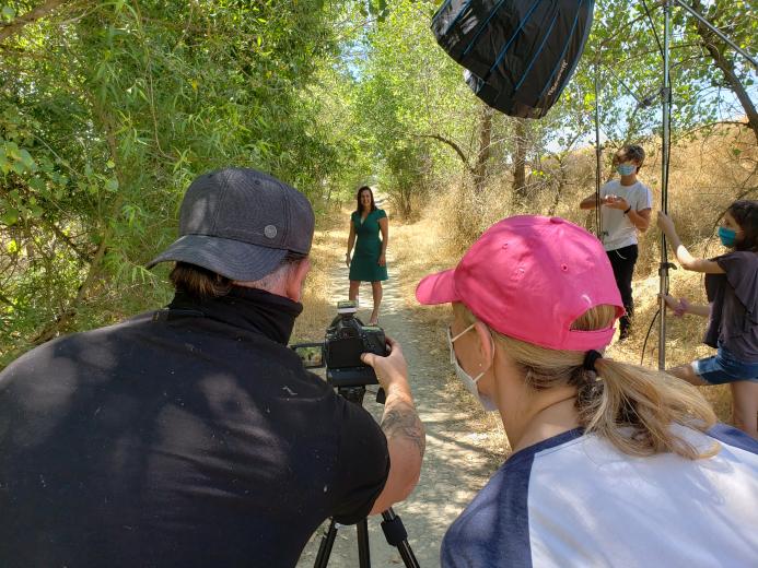 Photographer Terence Duffy and Art Director Carly Cornejo check images of Chelsea Minor, corporate director of public affairs for Raley’s.