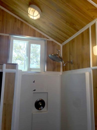 View of the shower stall and bathroom in progress View of the shower stall and bathroom in progress