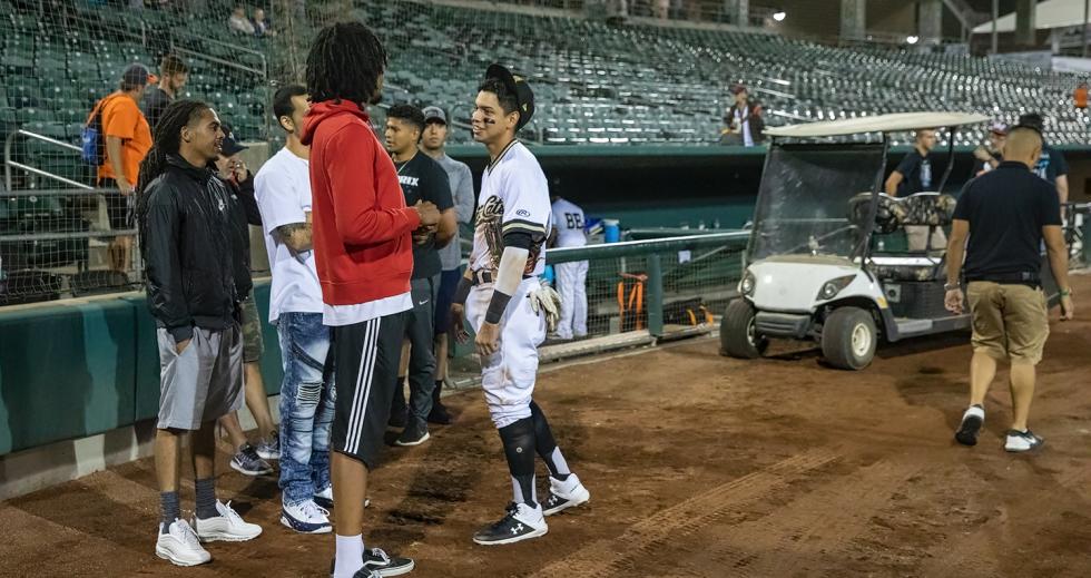 Mauricio Dubon talks with former teammates from his Capital Christian School team after the Aug. 20 game. Dubon, who graduated from the school in 2013, was called up to the Giants about a week later. (Photo by Steve Martarano)