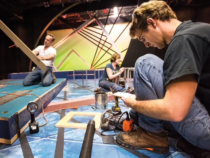 Steven Schmidt (pictured front), the technical director for B Street Theatre, manages the budget and technical elements of the set design. Steven Schmidt (pictured front), the technical director for B Street Theatre, manages the budget and technical elements of the set design.
