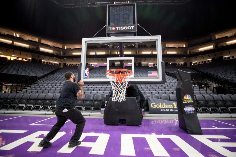 The last thing the crew will do before calling it a night is to roll the hoops onto the floor and into their rightful places on either end of the court. Game on.
