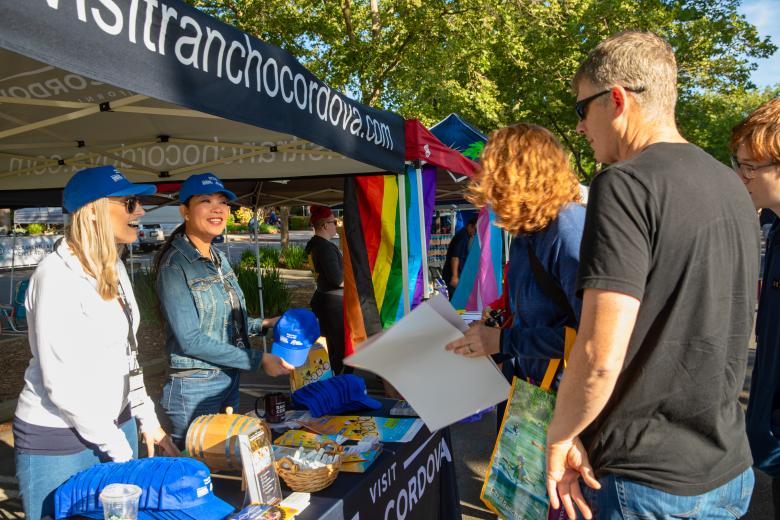 From left: Alyson Brian with Courtyard by Marriott and Sheila Torres with the Hampton Inn greet visitors from the Visit Rancho Cordova booth at the pre-race festival in front of City Hall on May 13. The city touts having more than 100 restaurants and 16 lodging opportunities.