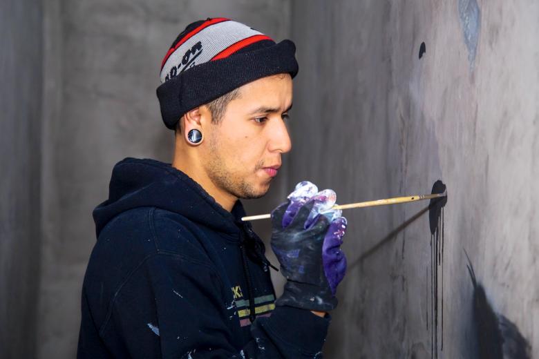 Irubiel Morena paints a mural in the 12th St. lobby Irubiel Morena paints a mural in the 12th St. lobby