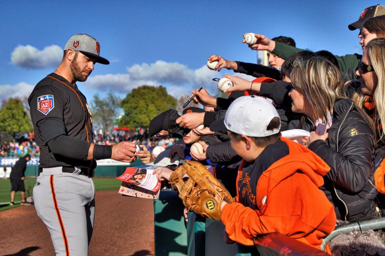 New Giants’ third baseman Evan Longoria signs autographs for fans at Raley Field.